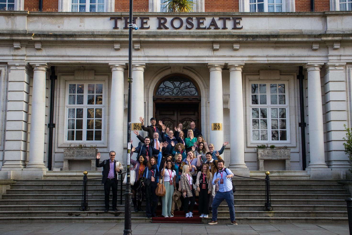 Group posing on the steps of Reading Roseate